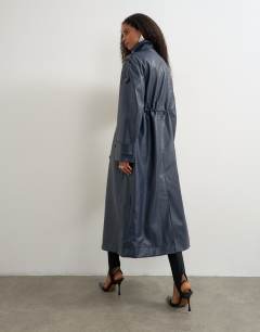 Model wearing Faux leather longline cinch waist trench coat in navy