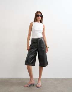 Model wearing Faux leather longline short in black
