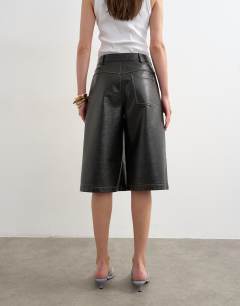Model wearing Faux leather longline short in black