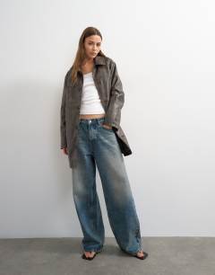 Model wearing Faux leather mid length jacket in washed brown