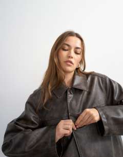Model wearing Faux leather mid length jacket in washed brown
