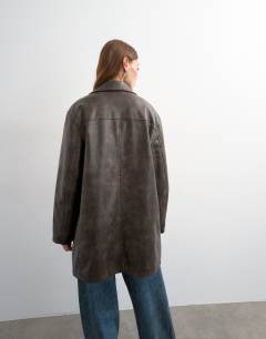 Model wearing Faux leather mid length jacket in washed brown