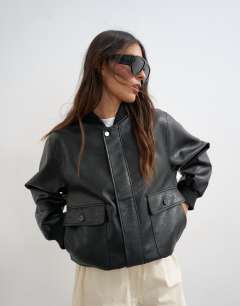 Model wearing Faux leather nero collar bomber jacket in black