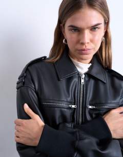 Model wearing Faux leather ovoid sleeve bomber jacket in washed black