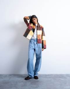 Model wearing Faux leather patchwork zip jacket in multi