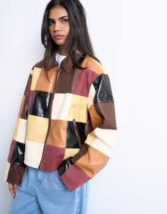 Model wearing Faux leather patchwork zip jacket in multi