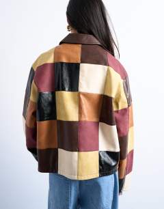 Model wearing Faux leather patchwork zip jacket in multi