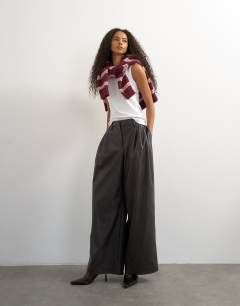 Model wearing Faux leather pleated in chocolate