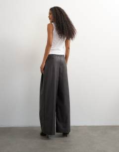 Model wearing Faux leather pleated in chocolate