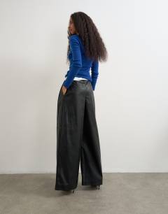 Model wearing Faux leather pleated trouser in black