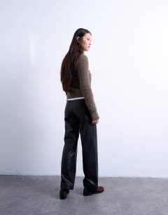 Model wearing Faux leather seam detail straight leg trouser in black