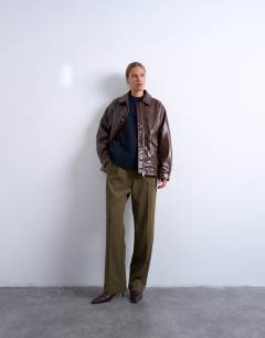 Model wearing Faux leather shiny mottled patch pocket shacket in brown