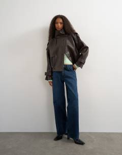 Model wearing Faux leather short mac in brown