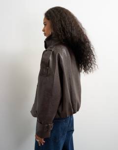 Model wearing Faux leather short mac in brown