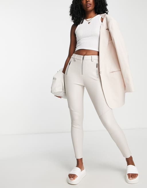 Topshop faux leather skinny pants with front hem slits in off white