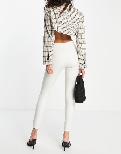 Topshop faux leather skinny pants with front hem slits in off white