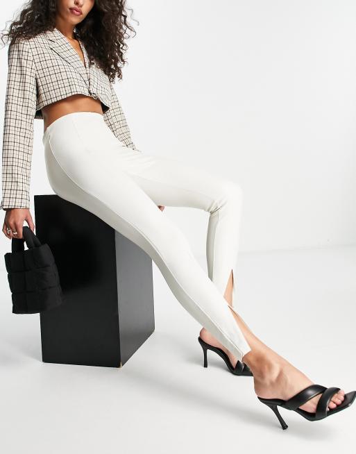 Topshop faux leather skinny pants with front hem slits in off white