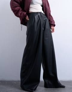 Model wearing Faux leather super wide leg trouser in black