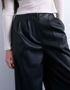 Model wearing Faux leather super wide leg trouser in black