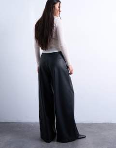 Model wearing Faux leather super wide leg trouser in black