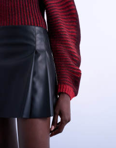 Model wearing Faux leather tailored mini skirt in black