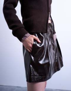 Model wearing Faux leather tailored mini skirt in coffee