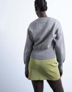 Model wearing Faux leather textured mini pelmet skirt in avocado