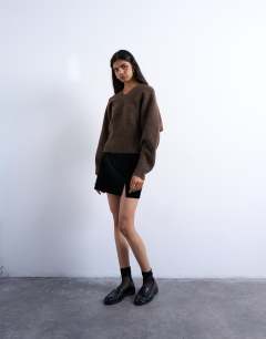 Model wearing Faux leather textured mini pelmet skirt in black