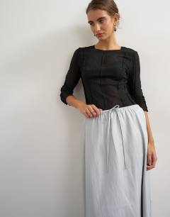 Model wearing Faux leather tie waist slouchy slim maxi skirt in light grey