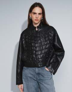 Model wearing Faux leather ultimate drummer jacket in black