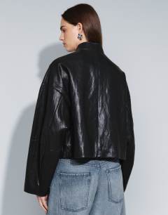 Model wearing Faux leather ultimate drummer jacket in black