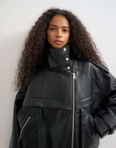 Model wearing Faux leather ultimate funnel biker in black