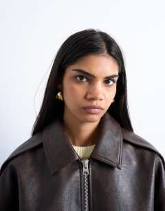 Model wearing Faux leather vintage wash seam detail zip thru bomber jacket in washed brown