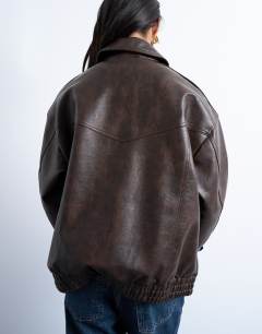 Model wearing Faux leather vintage wash seam detail zip thru bomber jacket in washed brown