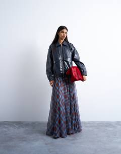 Model wearing Faux leather washed blue bomber jacket in washed blue