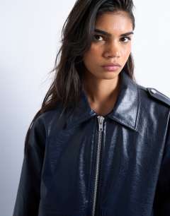 Model wearing Faux leather washed blue bomber jacket in washed blue