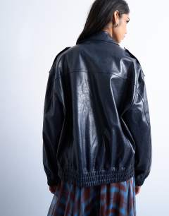 Model wearing Faux leather washed blue bomber jacket in washed blue