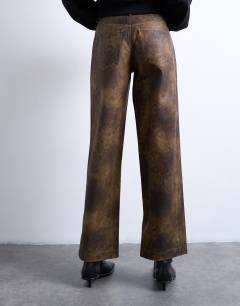 Model wearing Faux leather washed brown straight leg trouser in brown