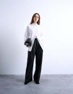Model wearing Faux leather wide leg jogger with pinseam detail in black