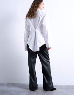 Model wearing Faux leather wide leg jogger with pinseam detail in black