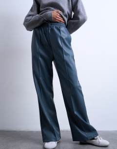 Model wearing Faux leather wide leg jogger with pinseam detail in blue