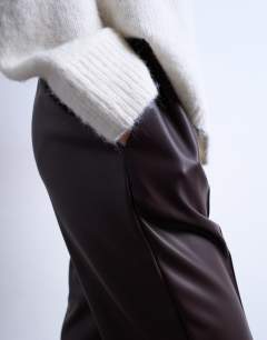 Model wearing Faux leather wide leg jogger with pinseam detail in chocolate