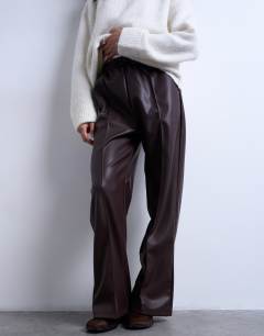 Model wearing Faux leather wide leg jogger with pinseam detail in chocolate