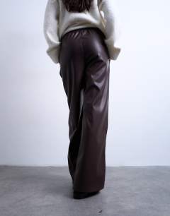 Model wearing Faux leather wide leg jogger with pinseam detail in chocolate