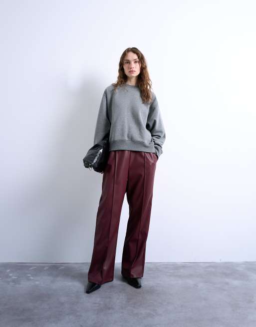 Topshop faux leather wide leg sweatpants with pinseam detail in burgundy