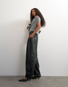 Model wearing Faux leather yoke detail barrel leg in black