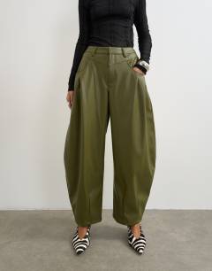 Model wearing Faux leather yoke detail barrel leg in khaki