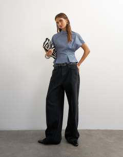 Model wearing Faux leather zip detail batwing top in soft blue