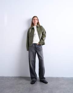 Model wearing Faux leather zip through jacket with patch pockets in washed green