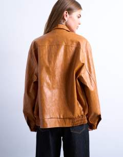Model wearing Faux leather zip through seam detail jacket in tan